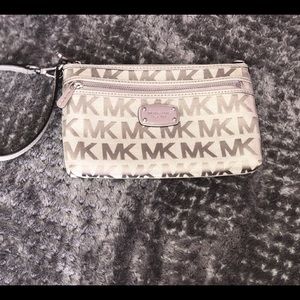 Michael Kor’s light gray wristlet